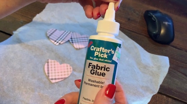 Gluing faux leather heart earrings together, front and back