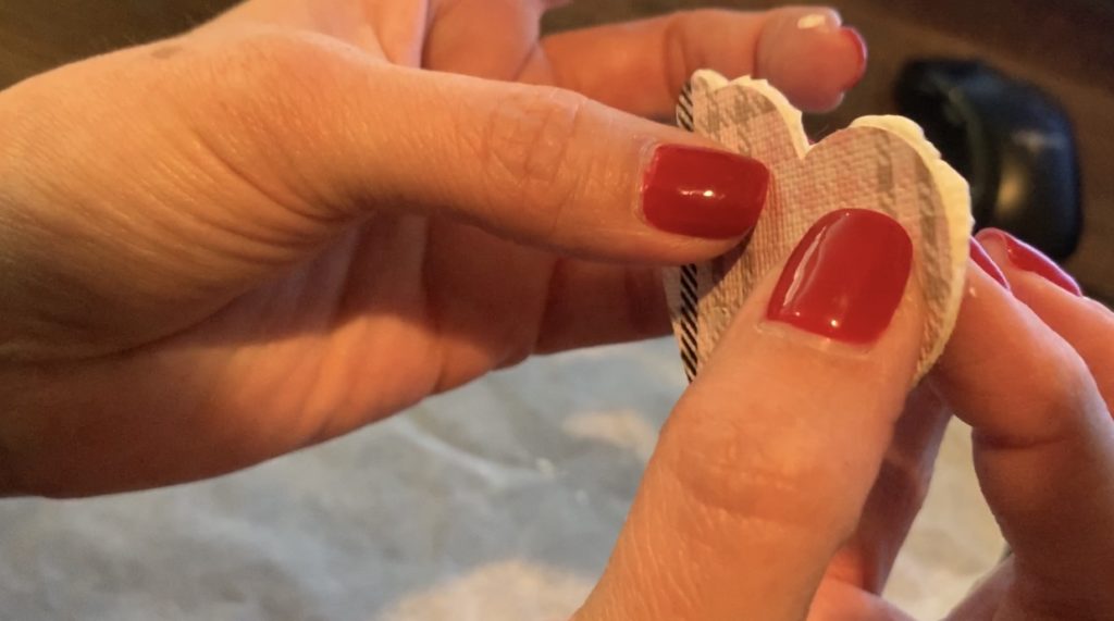 Gluing faux leather heart earrings together, front and back