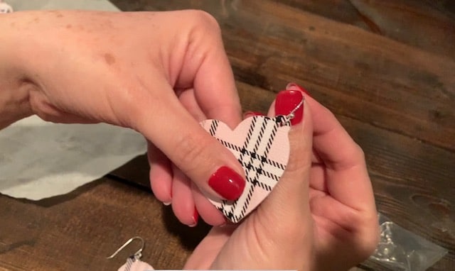 Putting hooks onto the Valentine's Day earrings DIY project