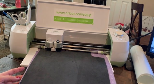 leather teardrop earrings cutting onto genuine leather on a Cricut machine