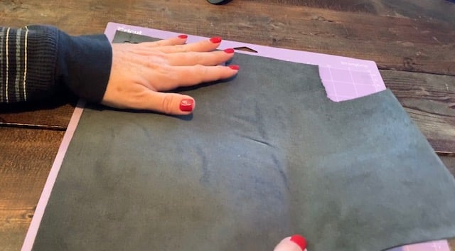 place real leather onto a purple cricut mat that is strong grip