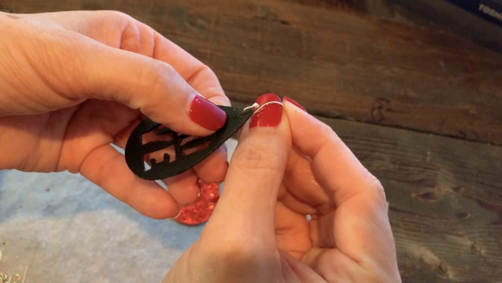 Putting Love earrings diy onto the hooks for Valentine's Day earrings