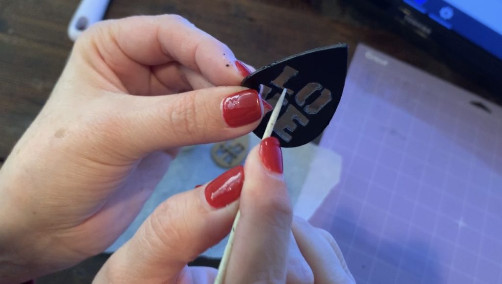 smooth edges of leather earrings to control flyaways