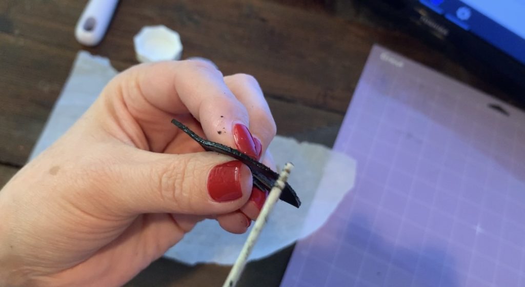 smooth edges of leather earrings to control flyaways