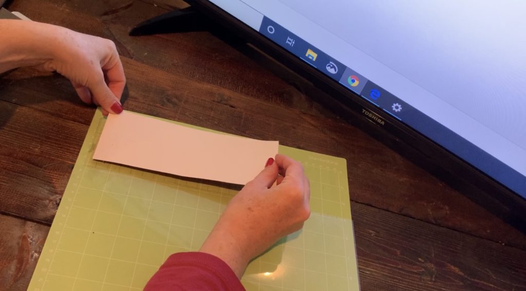 Cricut transfer paper on a Cricut mat before putting the glitter faux leather on the mat, to help it from making a mess on the mat