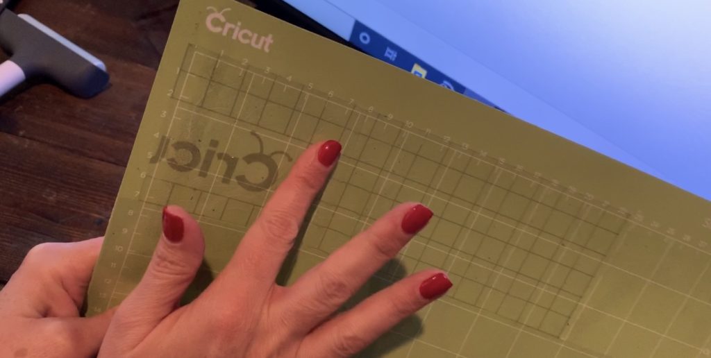 Cricut transfer paper on a Cricut mat before putting the glitter faux leather on the mat, to help it from making a mess on the mat