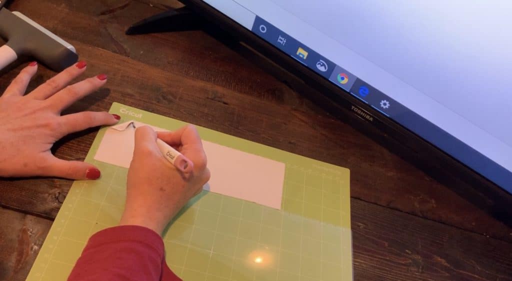 Cricut transfer paper on a Cricut mat before putting the glitter faux leather on the mat, to help it from making a mess on the mat