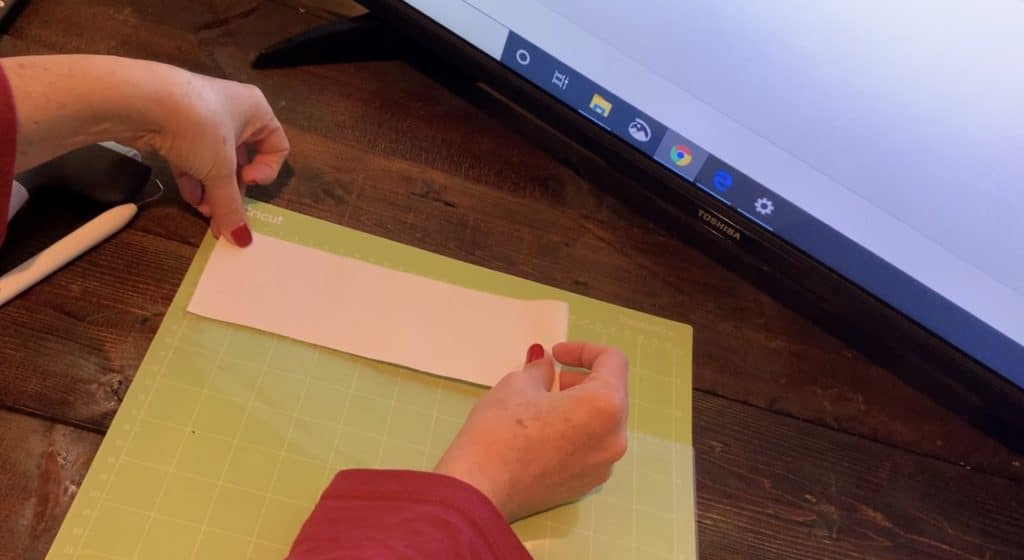 Cricut transfer paper on a Cricut mat before putting the glitter faux leather on the mat, to help it from making a mess on the mat