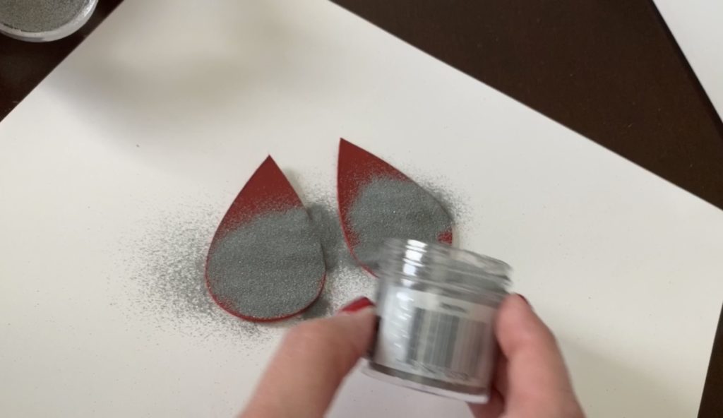 Embossing powder poured on top of the diy earring