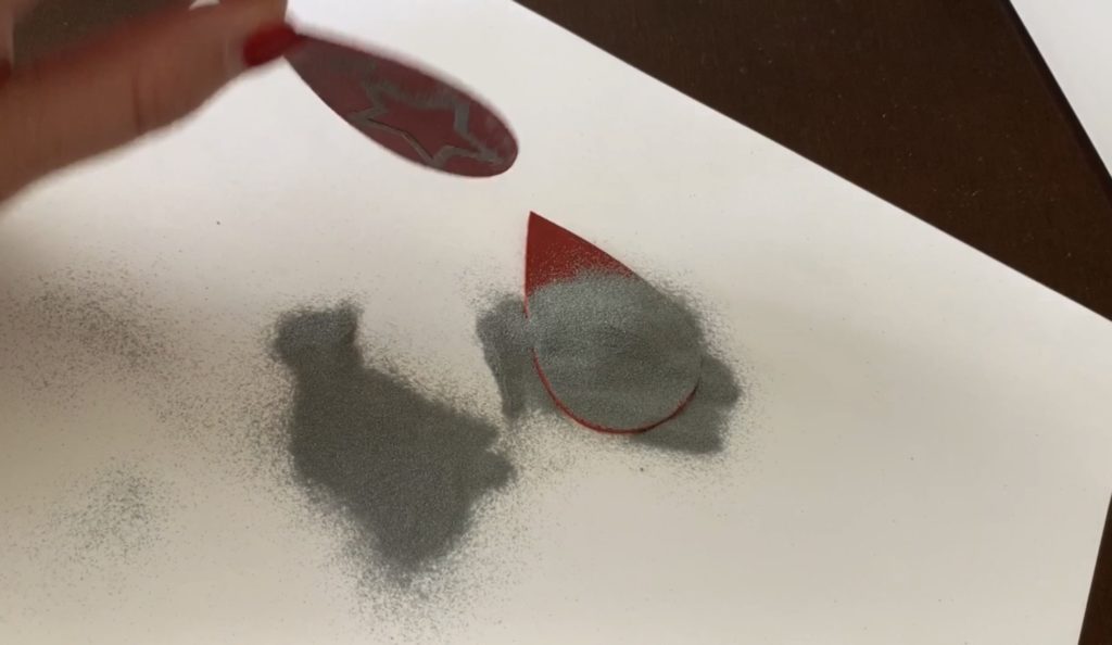 Embossing powder poured on top of the diy earring