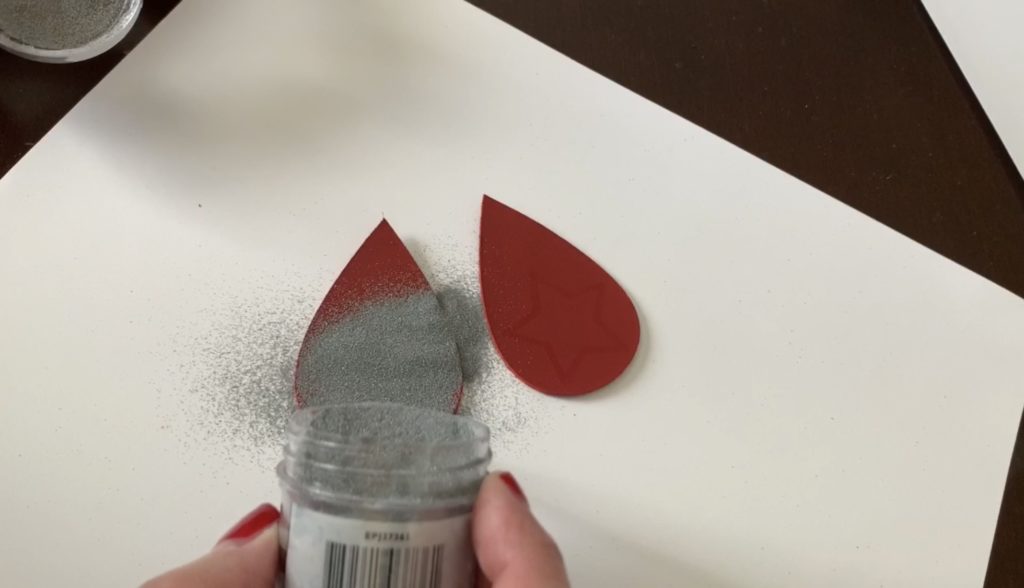 Embossing powder poured on top of the diy earring