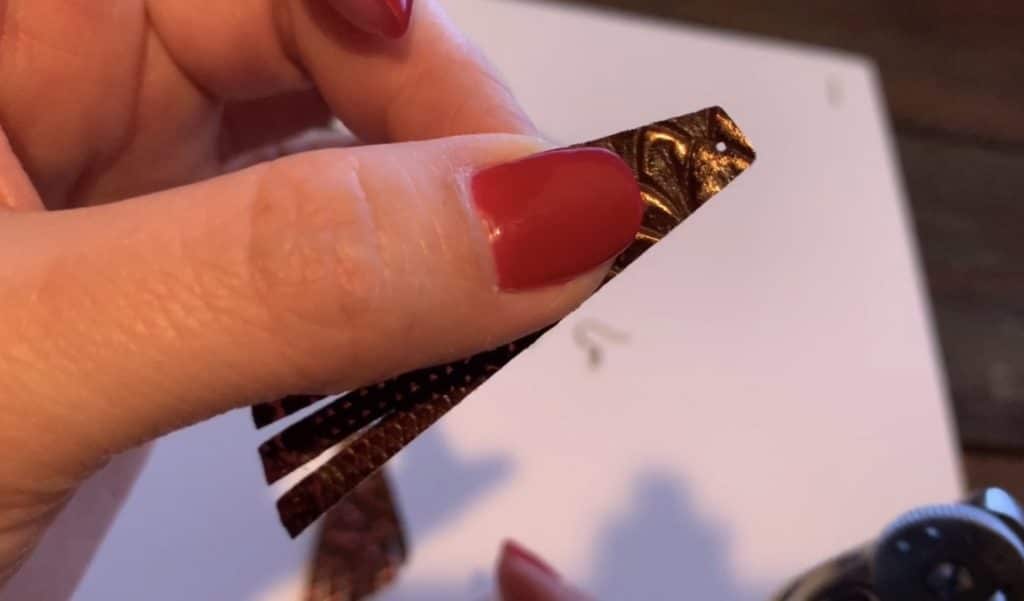 hole punched in diy leather earrings