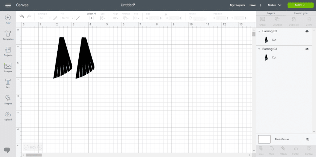 leather earrings on a mat before one of them is flipped