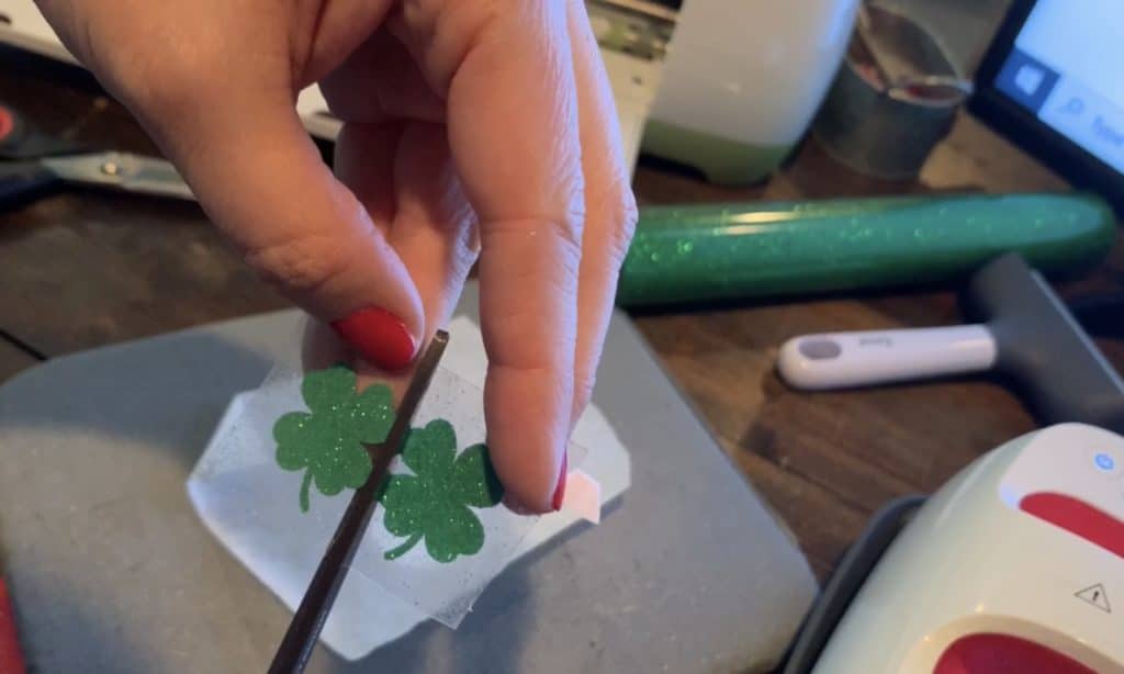 cutting the shamrocks from the heat transfer vinyl