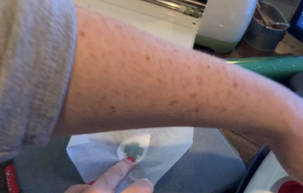 covering earring with a piece of parchment paper