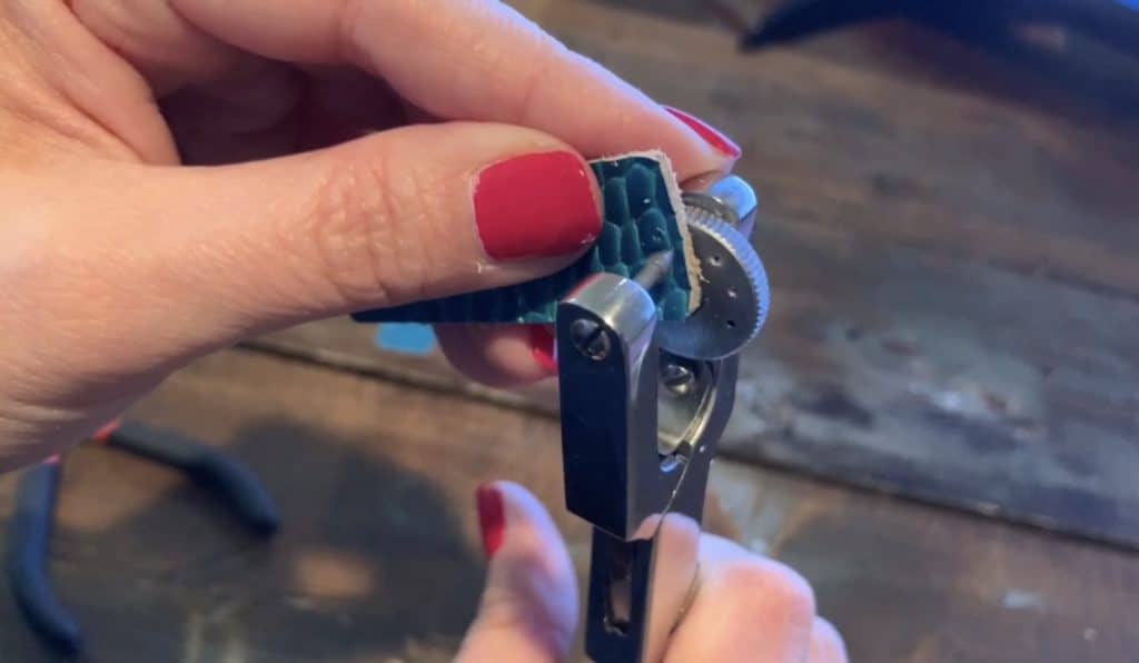 punching hole into leather earrings