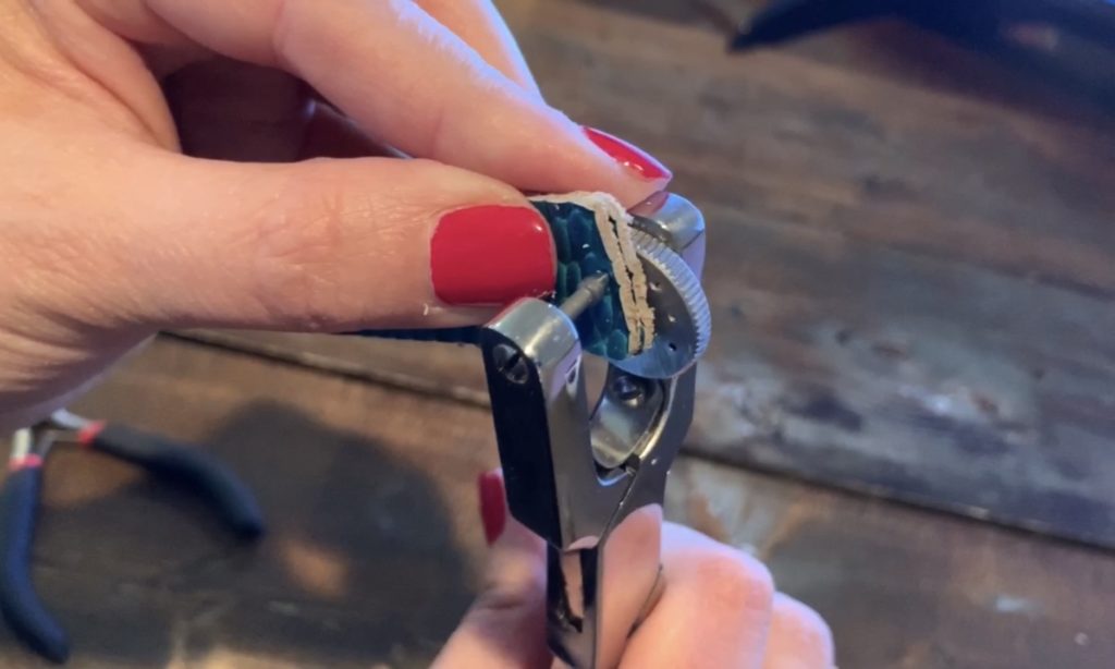 punching hole into leather earrings
