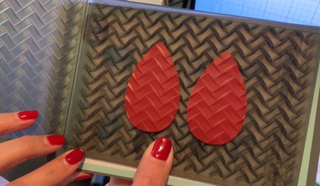 leather earrings on embossing folder