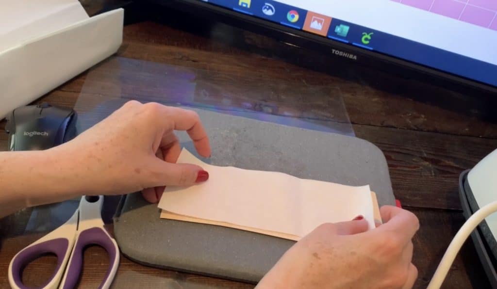 applying Heat n Bond to the back of Hobby Lobby faux leather