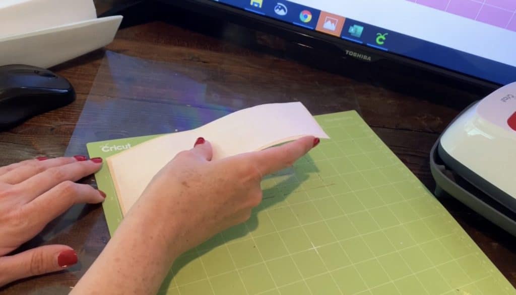 putting faux leather with heat n go backing onto Cricut mat