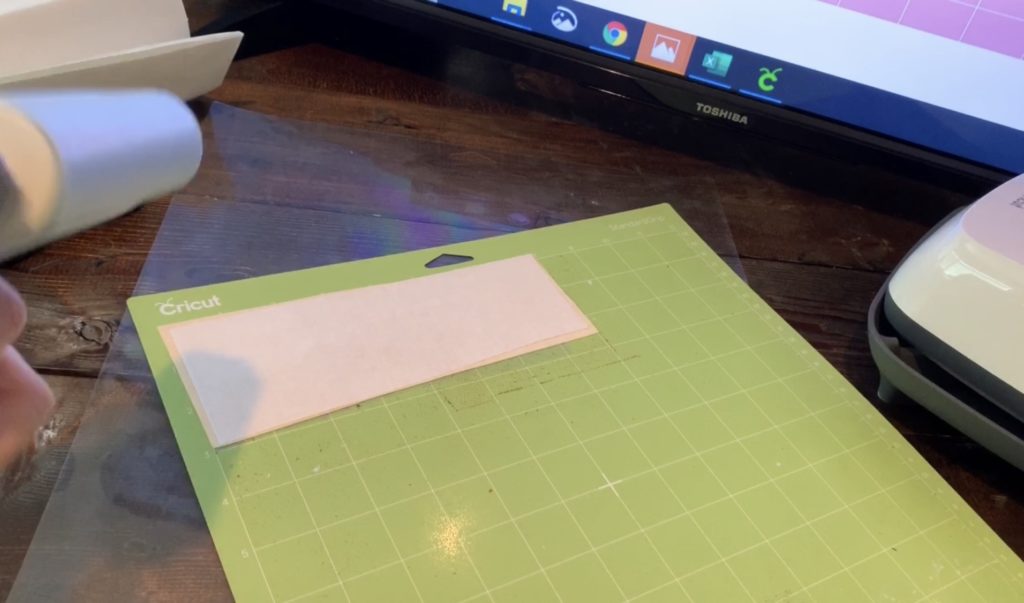 putting faux leather with heat n go backing onto Cricut mat