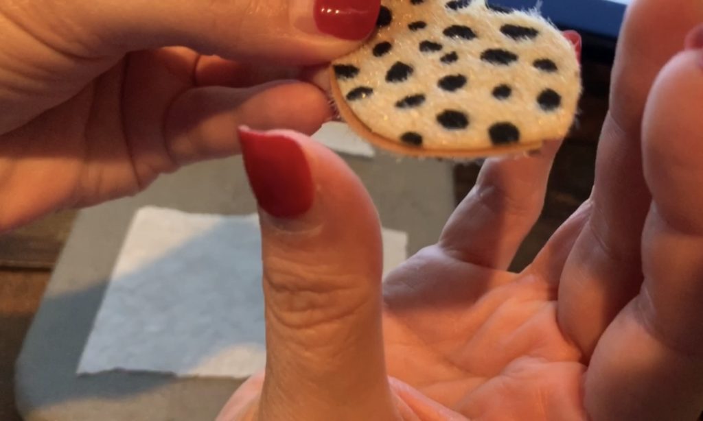 lining up the two earrings back to back, preparing to use Cricut Easy Press