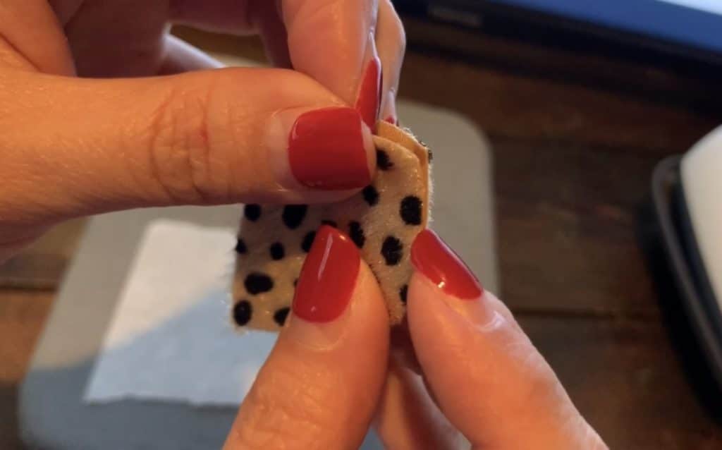 lining up the two earrings back to back, preparing to use Cricut Easy Press