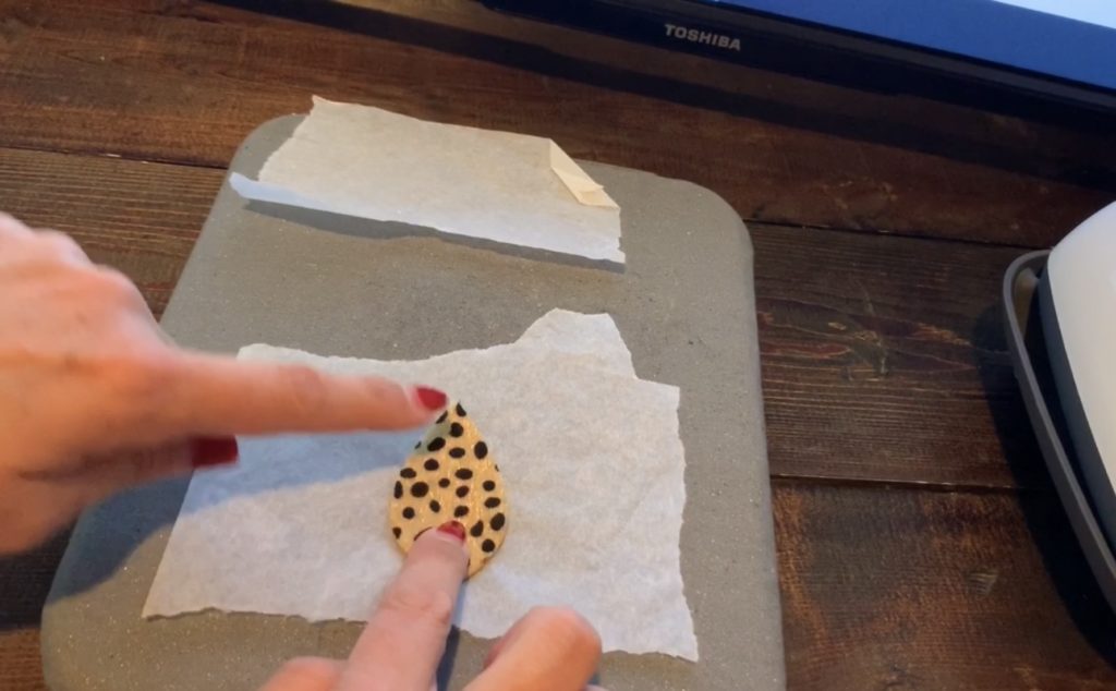 diy leather earrings on parchment paper