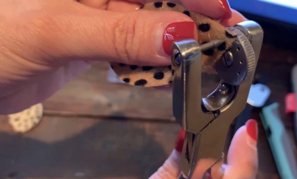 punching a hole in the faux leather earrings