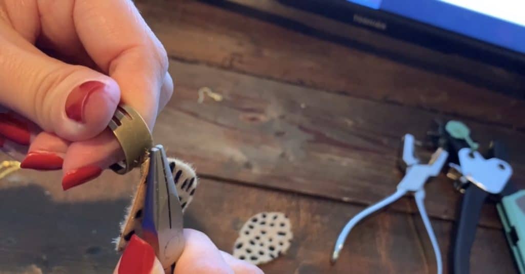 closing up the jump ring after putting all the components on