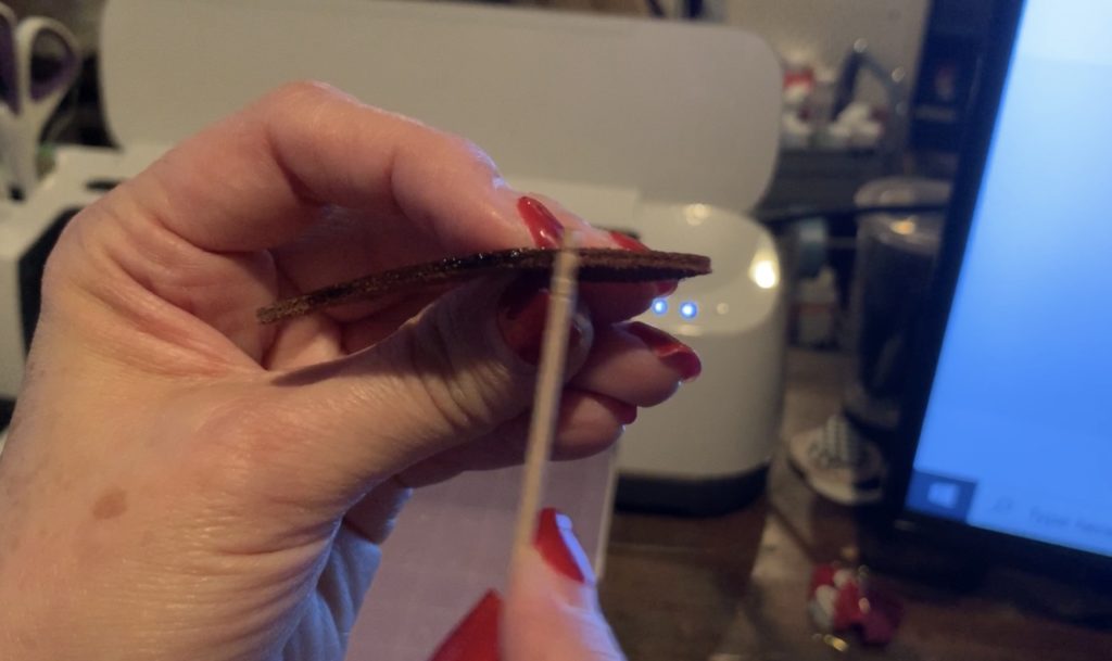 putting edge smoother onto leather earring