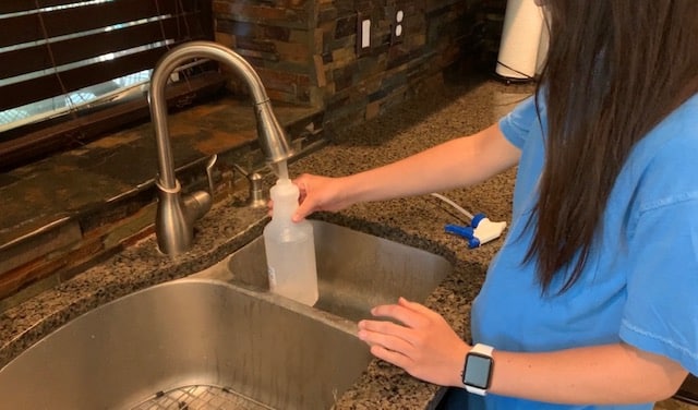 filling spray bottle with water