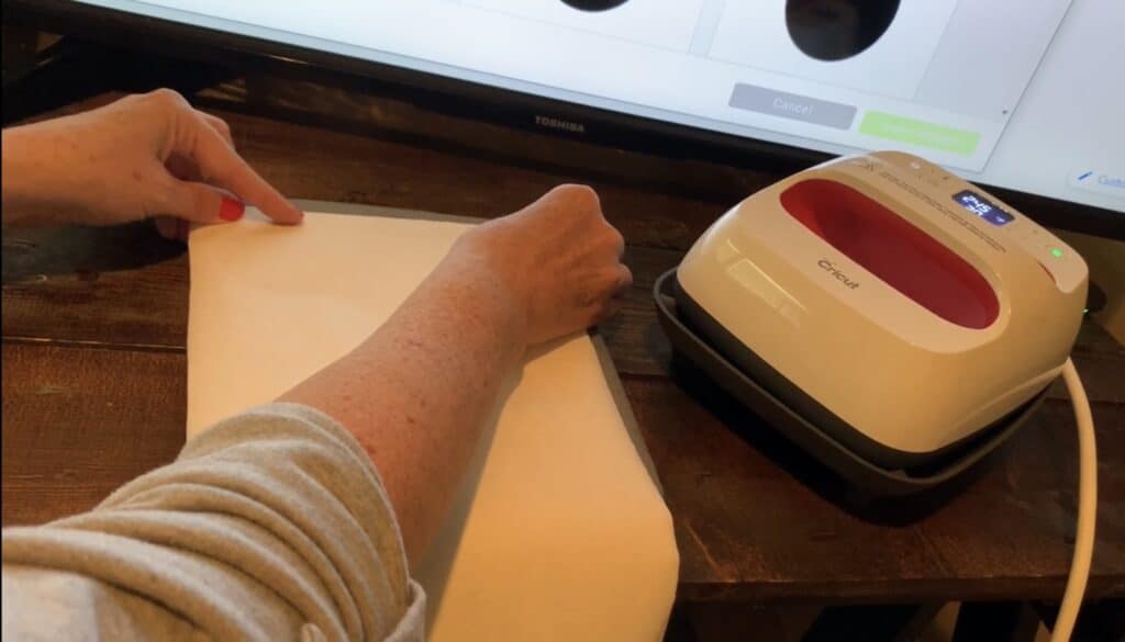 Placing heat n bond onto back of faux leather for diy leather earrings