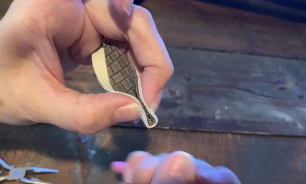 pinching the leather leaf earrings