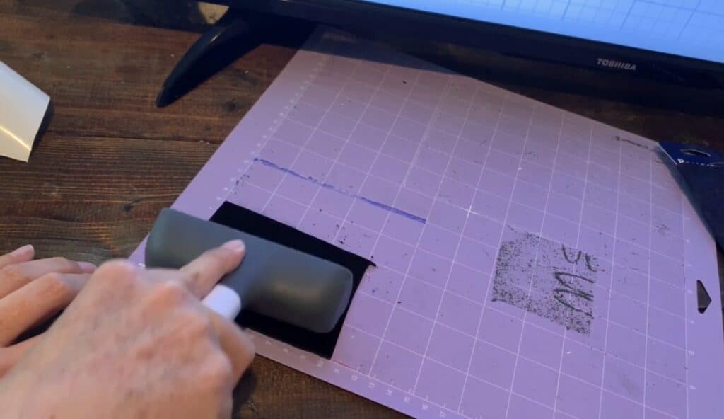 putting leather onto Cricut mat