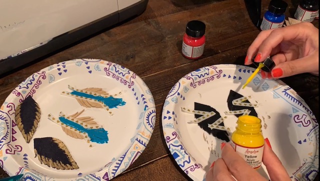 painted feather leather earrings