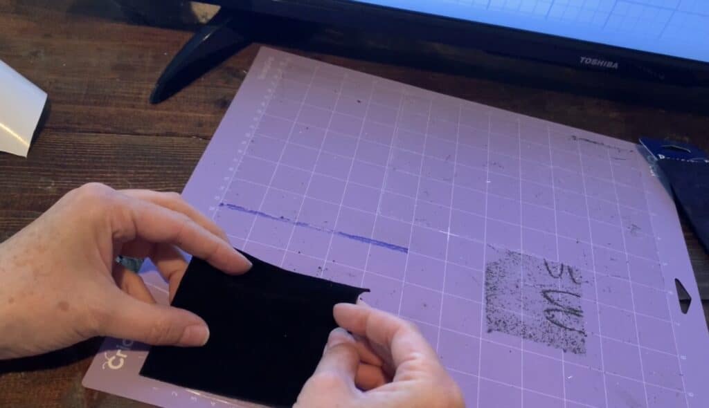 putting leather onto Cricut mat