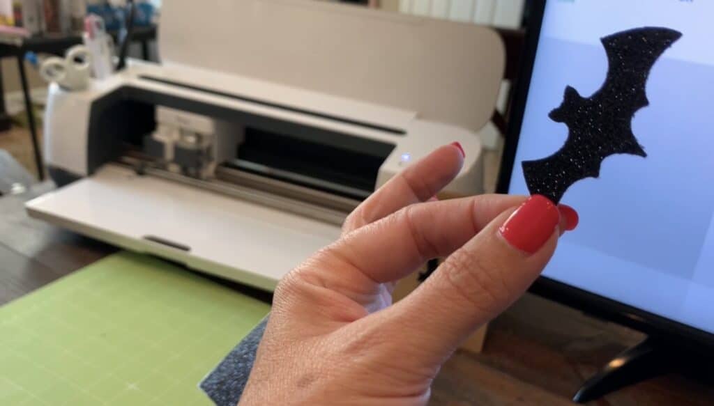 bat faux leather earrings, with bat cut from Cricut Maker