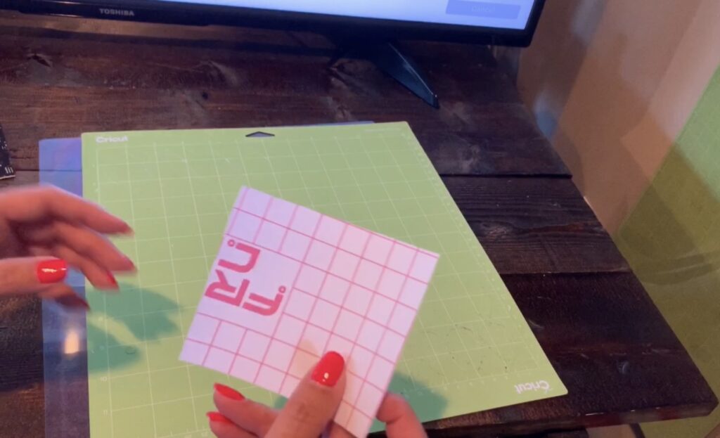 putting transfer paper on cricut mat