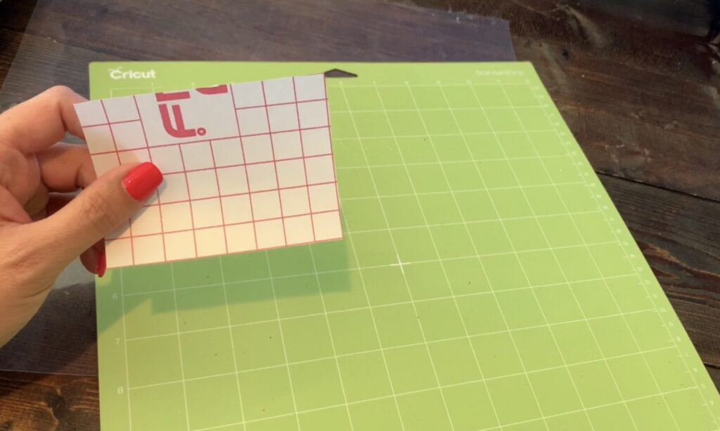 putting transfer paper on a Cricut standard grip mat to make diy earrings