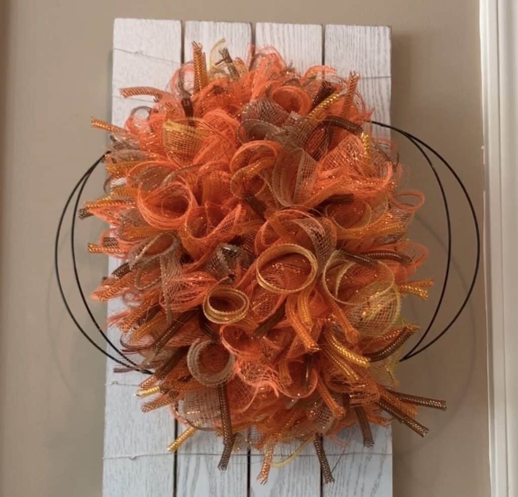 pumpkin mesh wreath diy with wreath about a third full of mesh bundles