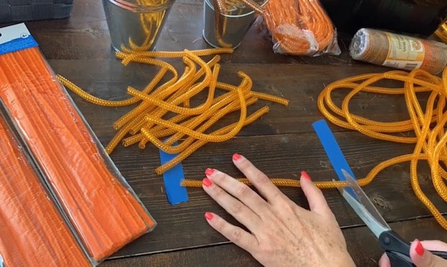 cutting dollar tree mesh tubing for mesh wreath for halloween