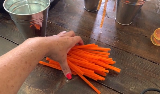 cutting pipe cleaners in half for mesh wreath diy