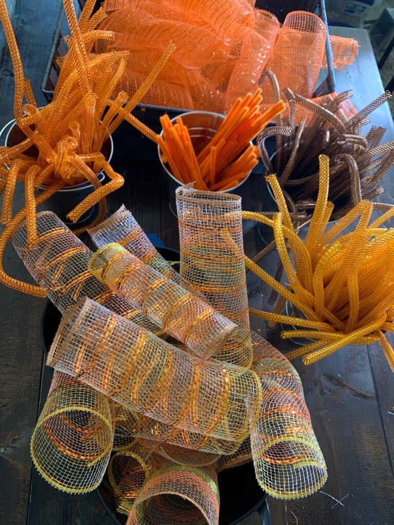 organize mesh pieces and pipe cleaners in buckets
