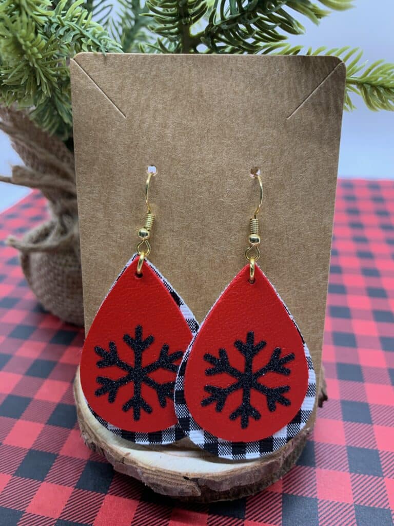 faux leather snowflake earrings with mini black and white buffalo check and red double sided faux leather