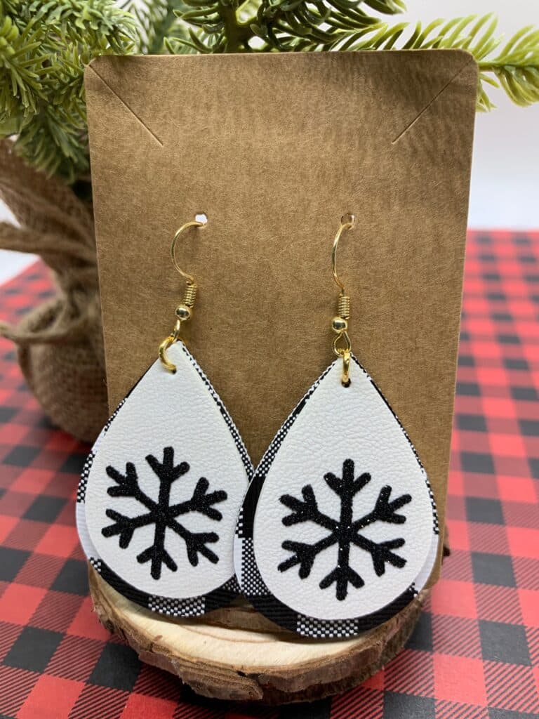 faux leather snowflake earrings with black and white buffalo check and white double sided faux leather