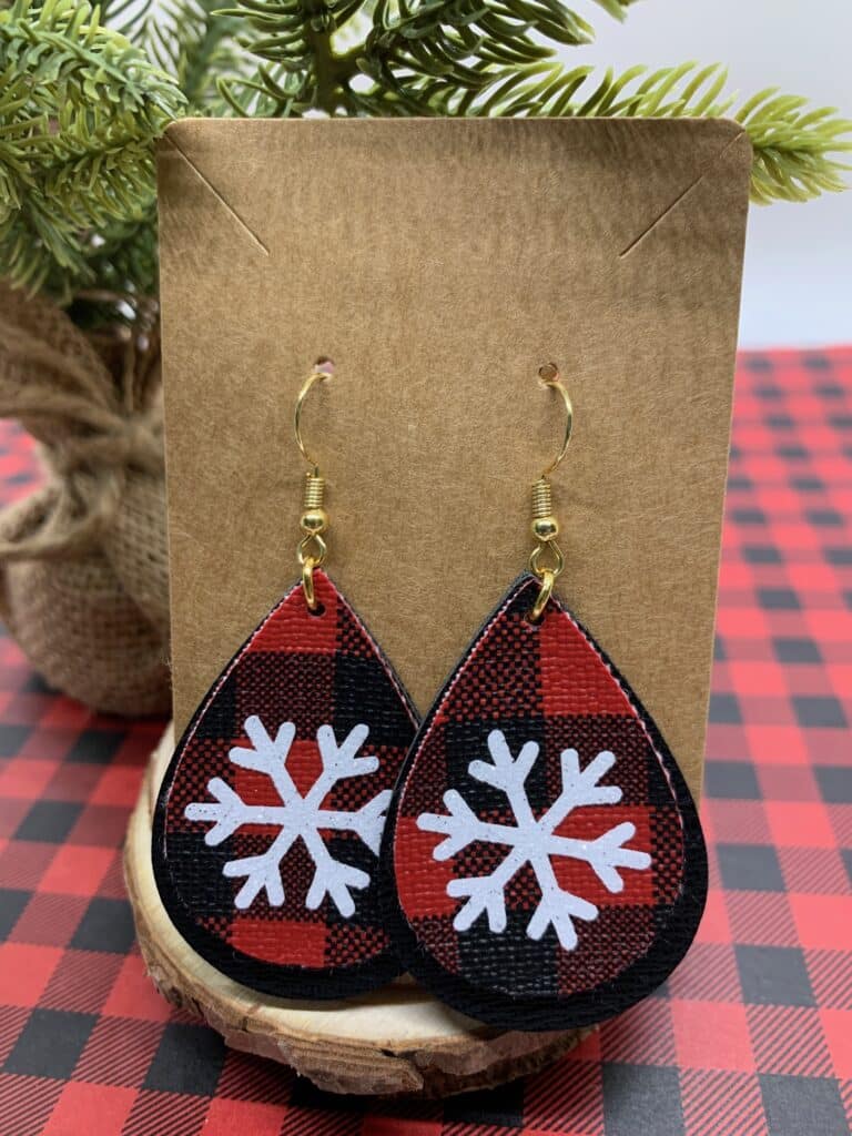 faux leather snowflake earrings with black and red buffalo check and black double sided faux leather