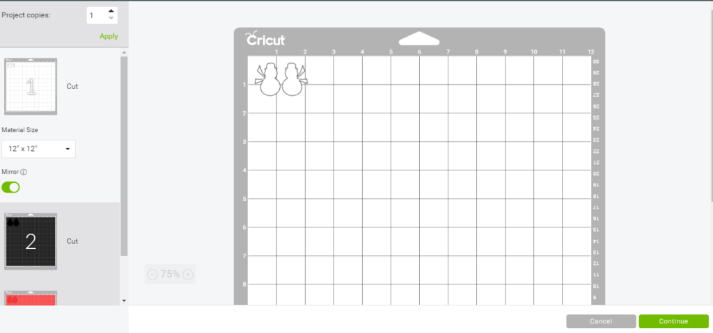 snowman earrings on the Cricut mat ready to cut