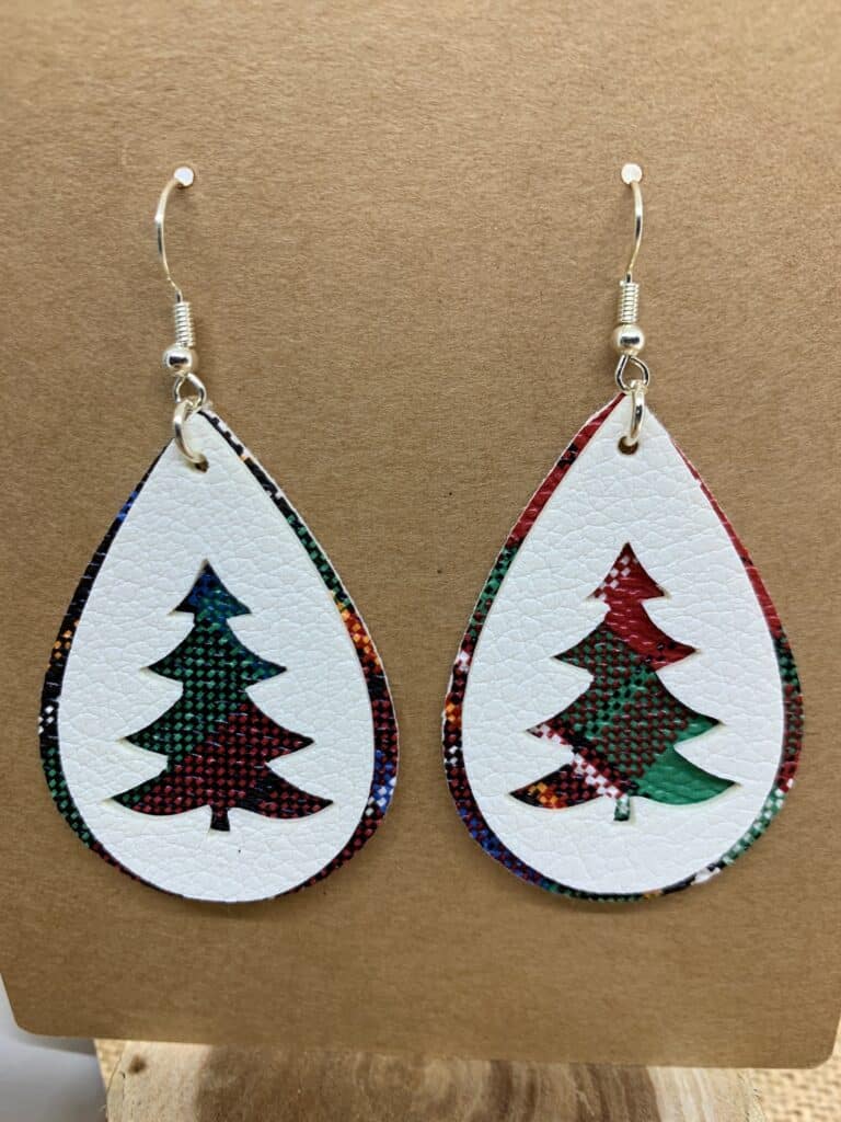 Christmas tree faux leather earrings made on a Cricut machine