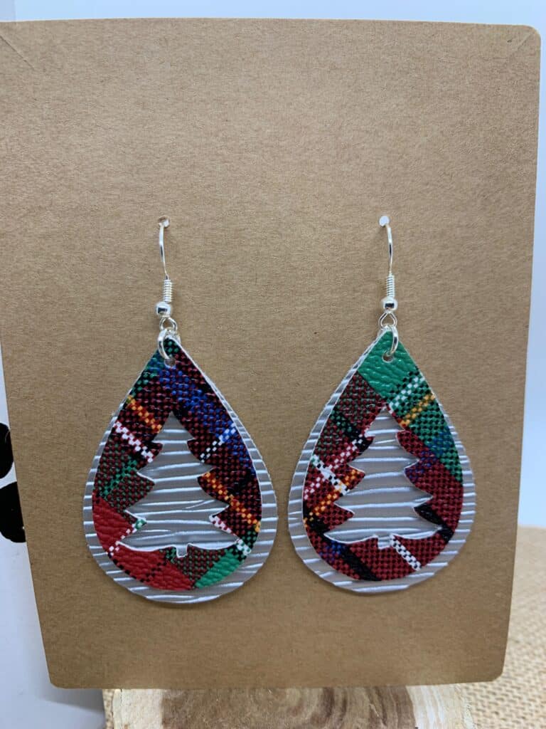 Christmas tree faux leather earrings made on a Cricut machine